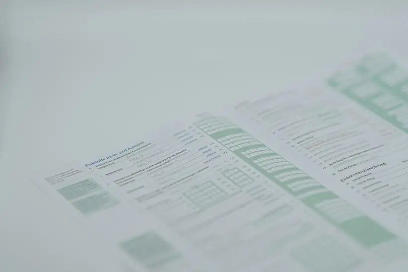 Printed insurance claim form with green columns, representing the remittance advice and denial codes on an electronic remittance