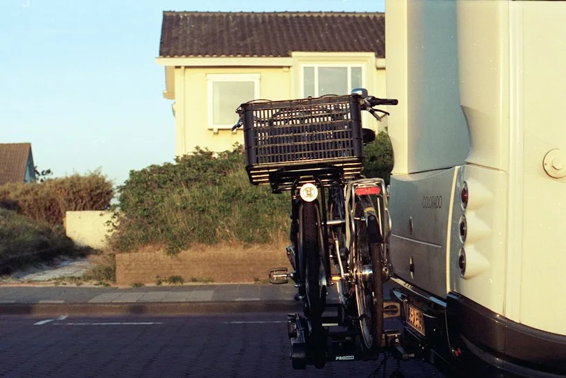 Wheelchair-accessible transport van parked outside a medical facility, representing non-emergency medical transportation billing