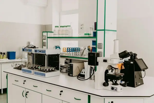 Pathology laboratory workstation with a microscope and specimen processing equipment