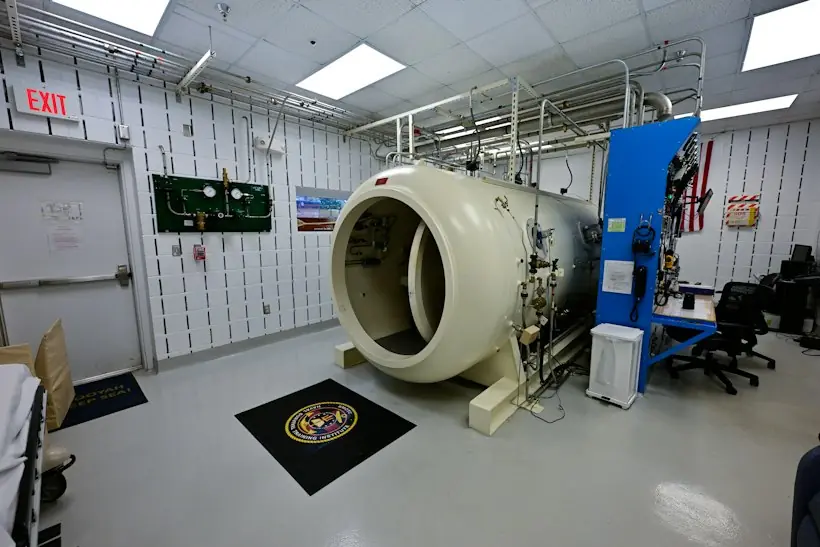 Hyperbaric oxygen therapy chamber in a hospital treatment room