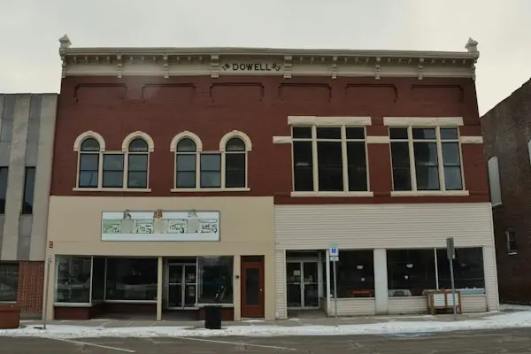 Brick main street building in a small town, representing a rural health clinic setting for Medicare billing
