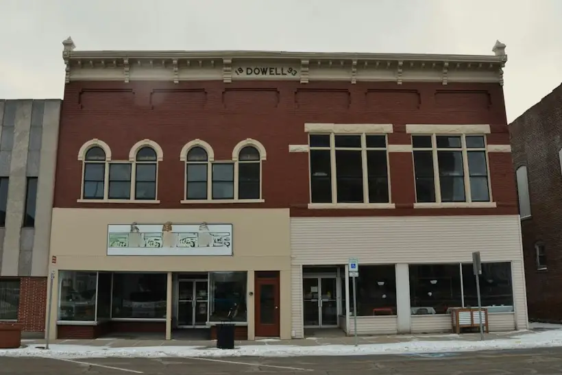 Brick main street building in a small town, representing a rural health clinic setting for Medicare billing